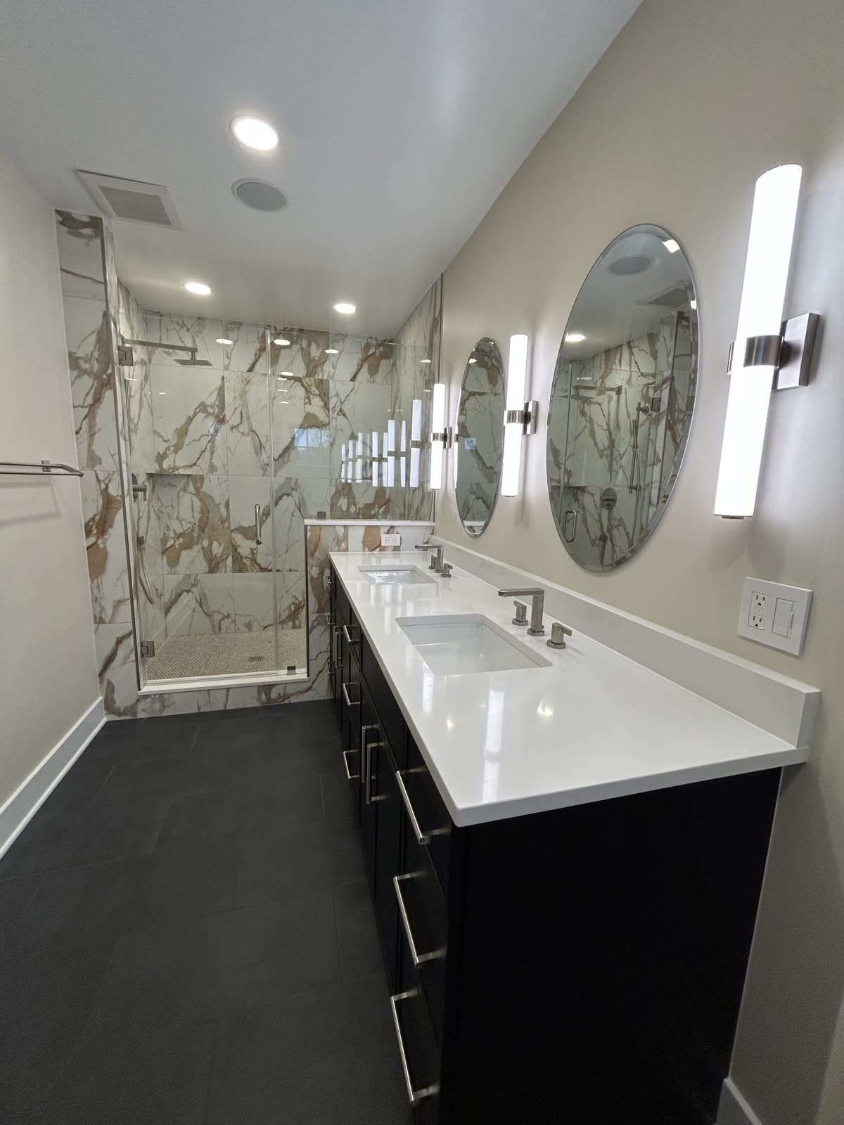 Bathroom with double vanity and marble shower
