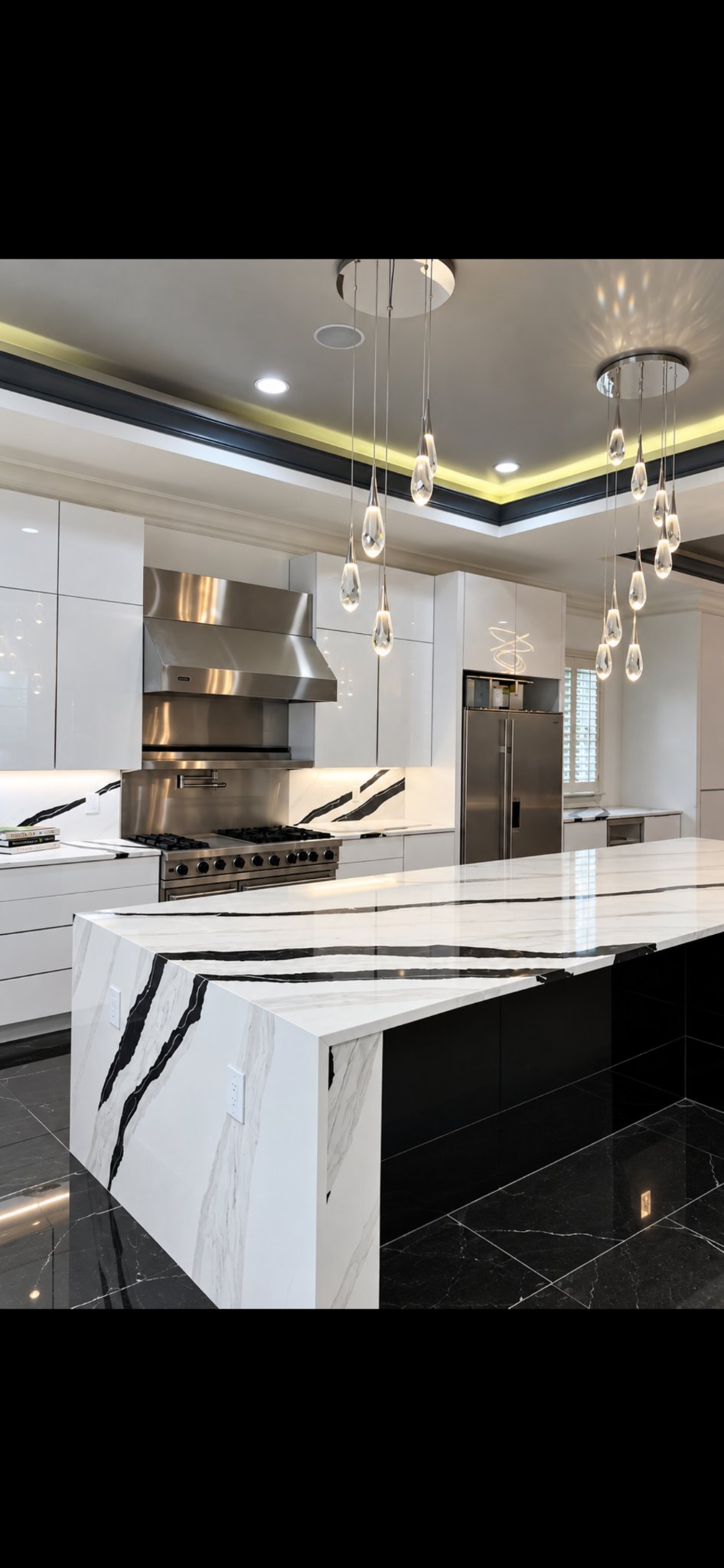 Luxury kitchen with marble waterfall island and custom pendant lighting